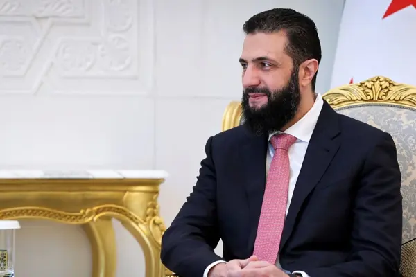 Syrian president removes brother from key position